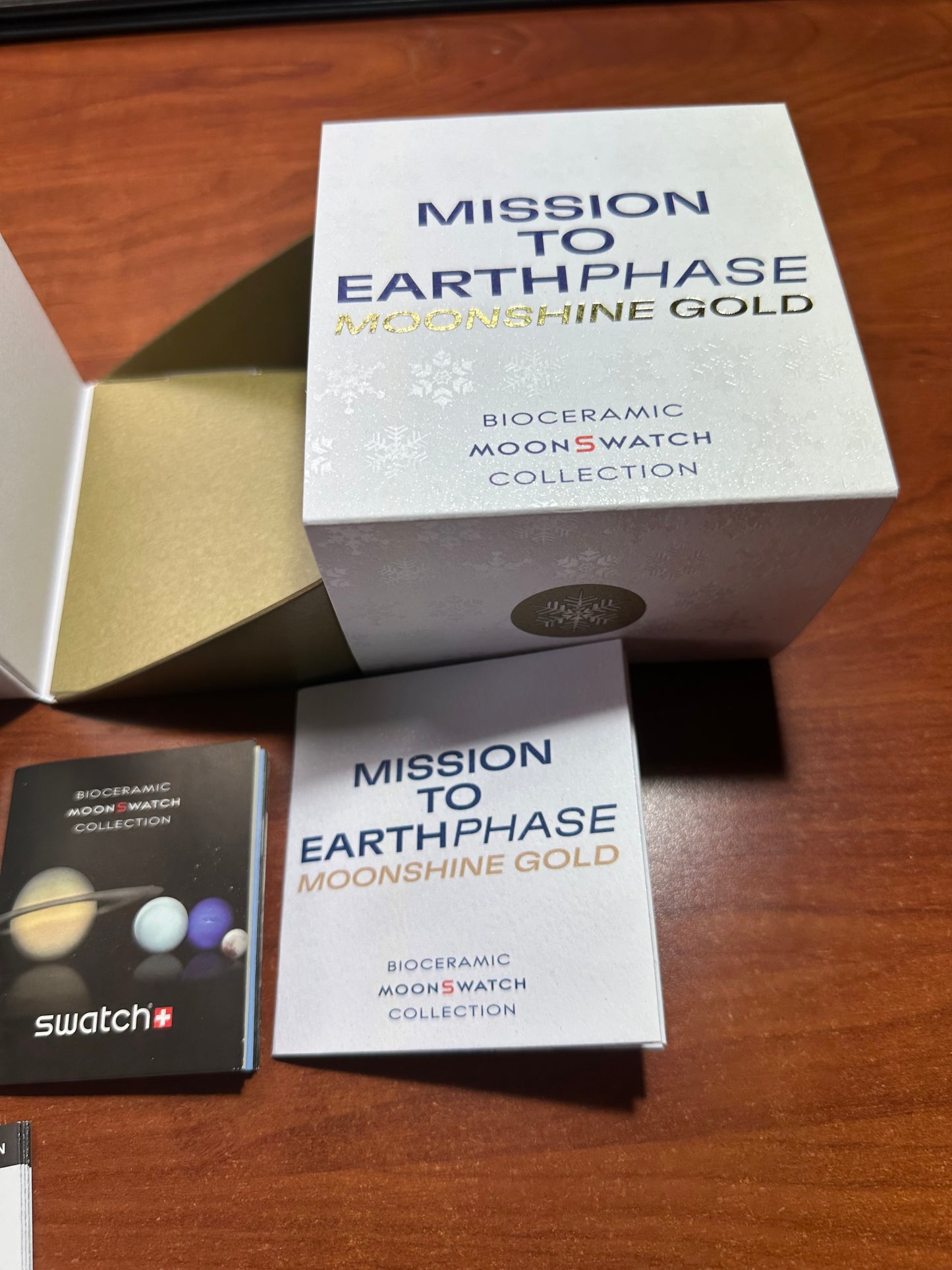 Swatch x omega mission to earthphase moonshine gold
